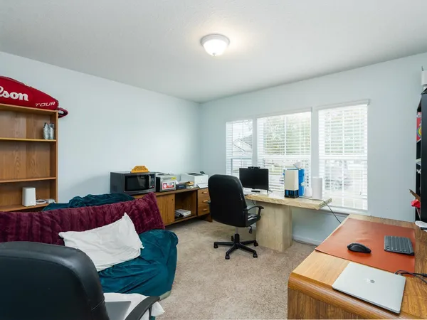 a view of a living room and floor to ceiling window