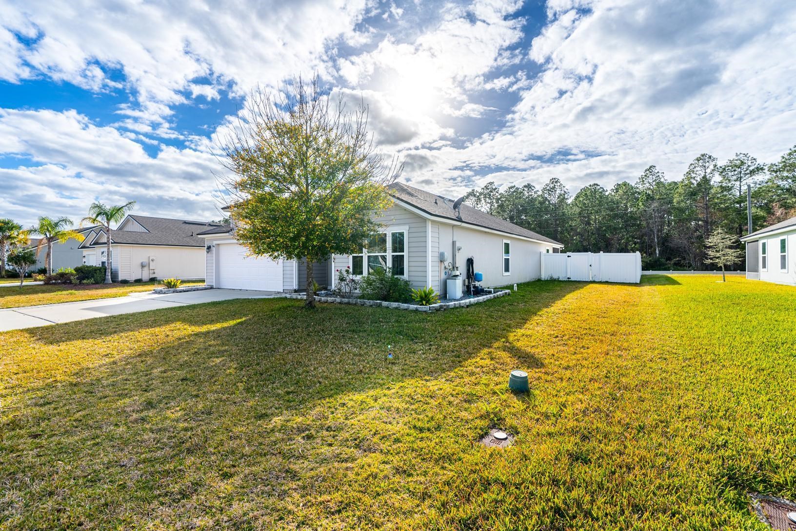 178 South Hamilton Springs Road St. Augustine, FL 32084 - Photo 2 of 26 a view of an house with swimming pool and a yard