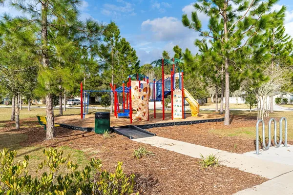 a swimming pool with outdoor seating