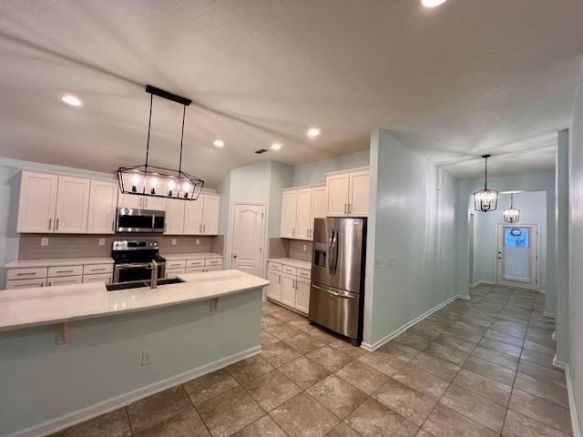 178 South Hamilton Springs Road St. Augustine, FL 32084 - Photo 7 of 26 a kitchen with stainless steel appliances a stove sink and refrigerator