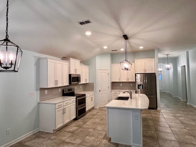 178 South Hamilton Springs Road St. Augustine, FL 32084 - Photo 9 of 26 a kitchen with kitchen island a sink stainless steel appliances and counter space