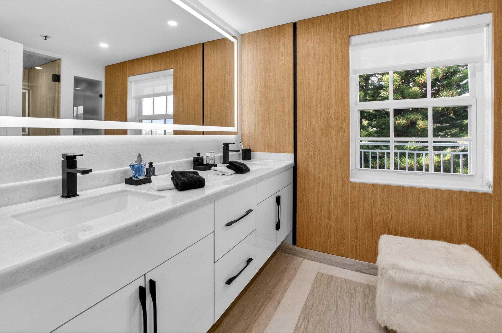 950 De Soto Road, Unit 5A Boca Raton, FL 33432 - Photo 59 of 98 a bathroom with a double vanity sink window and a mirror
