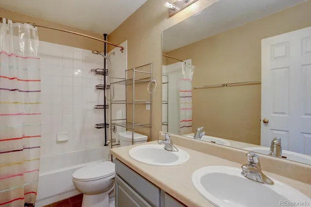 a bathroom with a sink toilet tub and shower