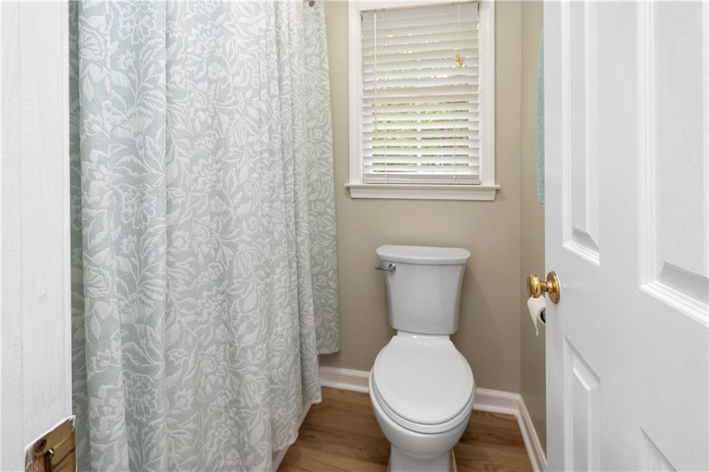 405 Ridgemont Drive Fayetteville, GA 30215 - Photo 28 of 43 a white toilet sitting next to a small window
