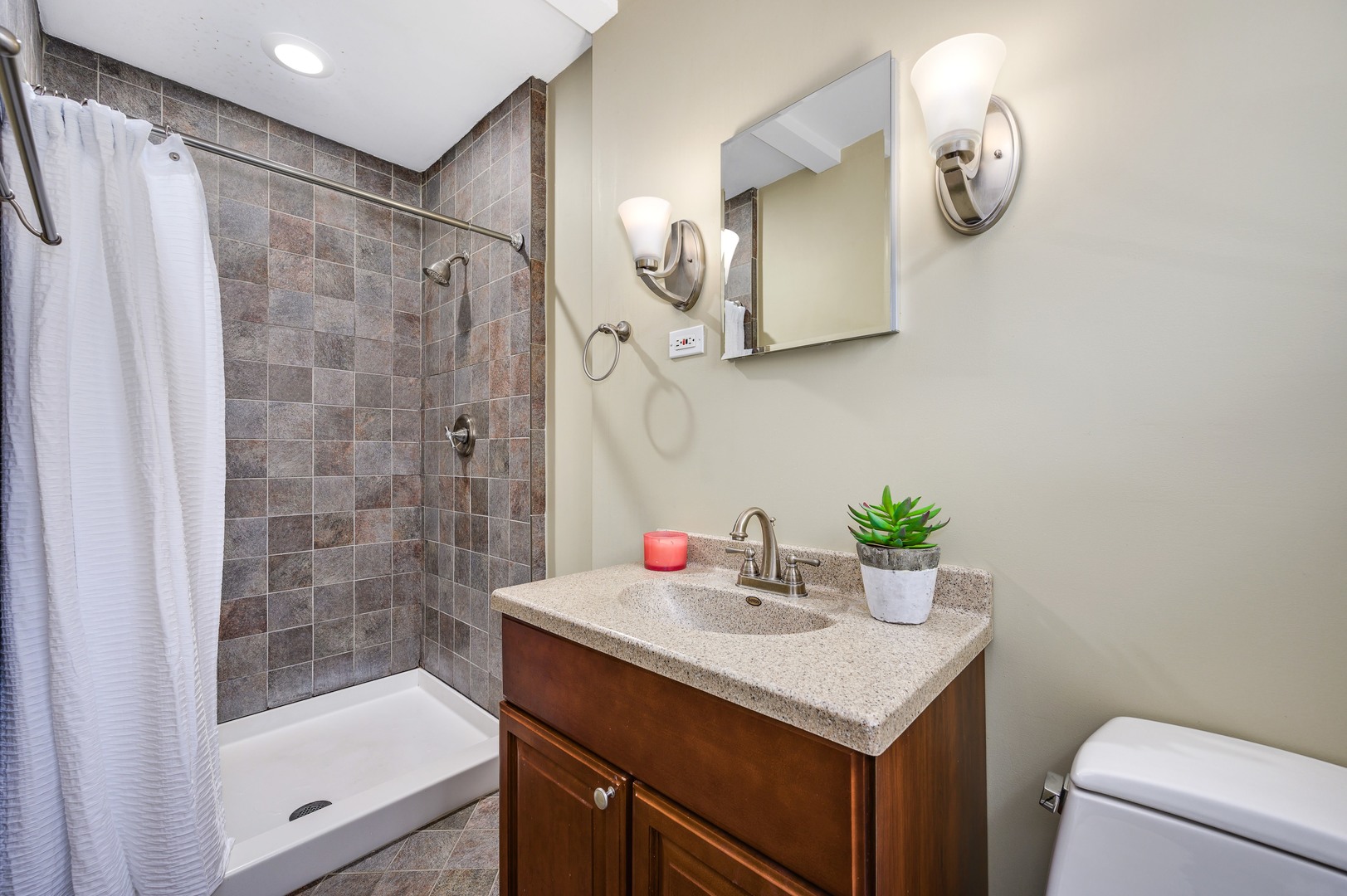 1924 Linneman Street Glenview, IL 60025 - Photo 16 of 24 a bathroom with a sink a toilet and shower