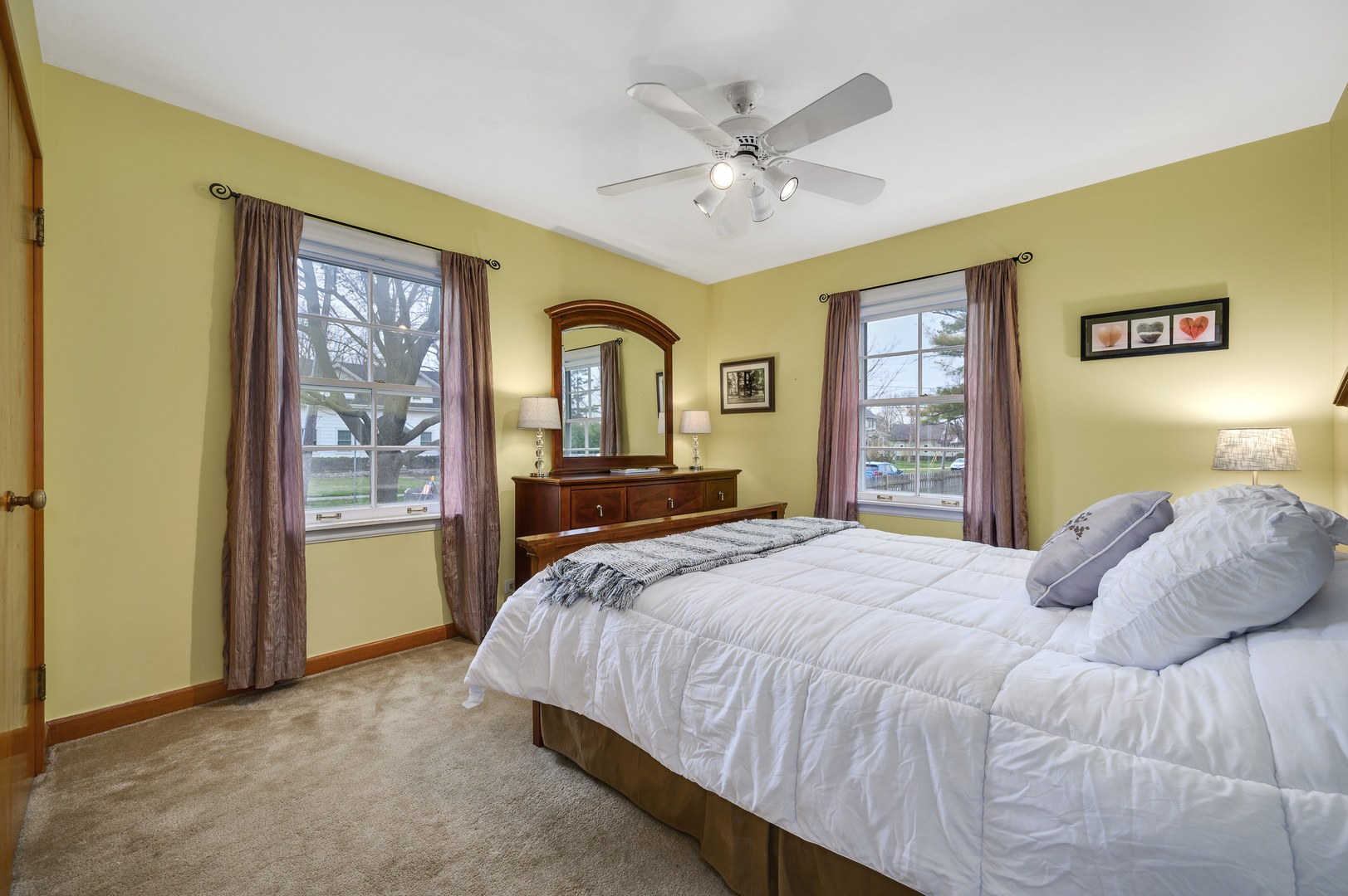 1924 Linneman Street Glenview, IL 60025 - Photo 18 of 24 a bedroom with a large bed and a chandelier