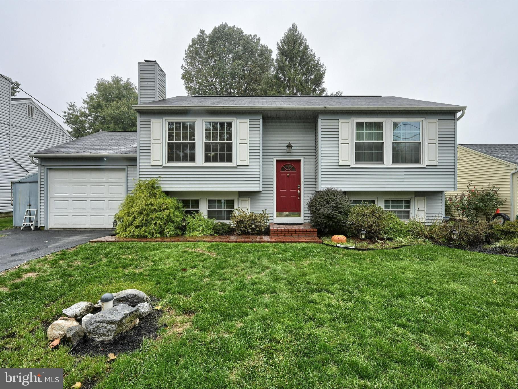 124 Petersburg Road Lancaster, PA 17601 - Photo 1 of 26 a front view of a house with a garden and porch
