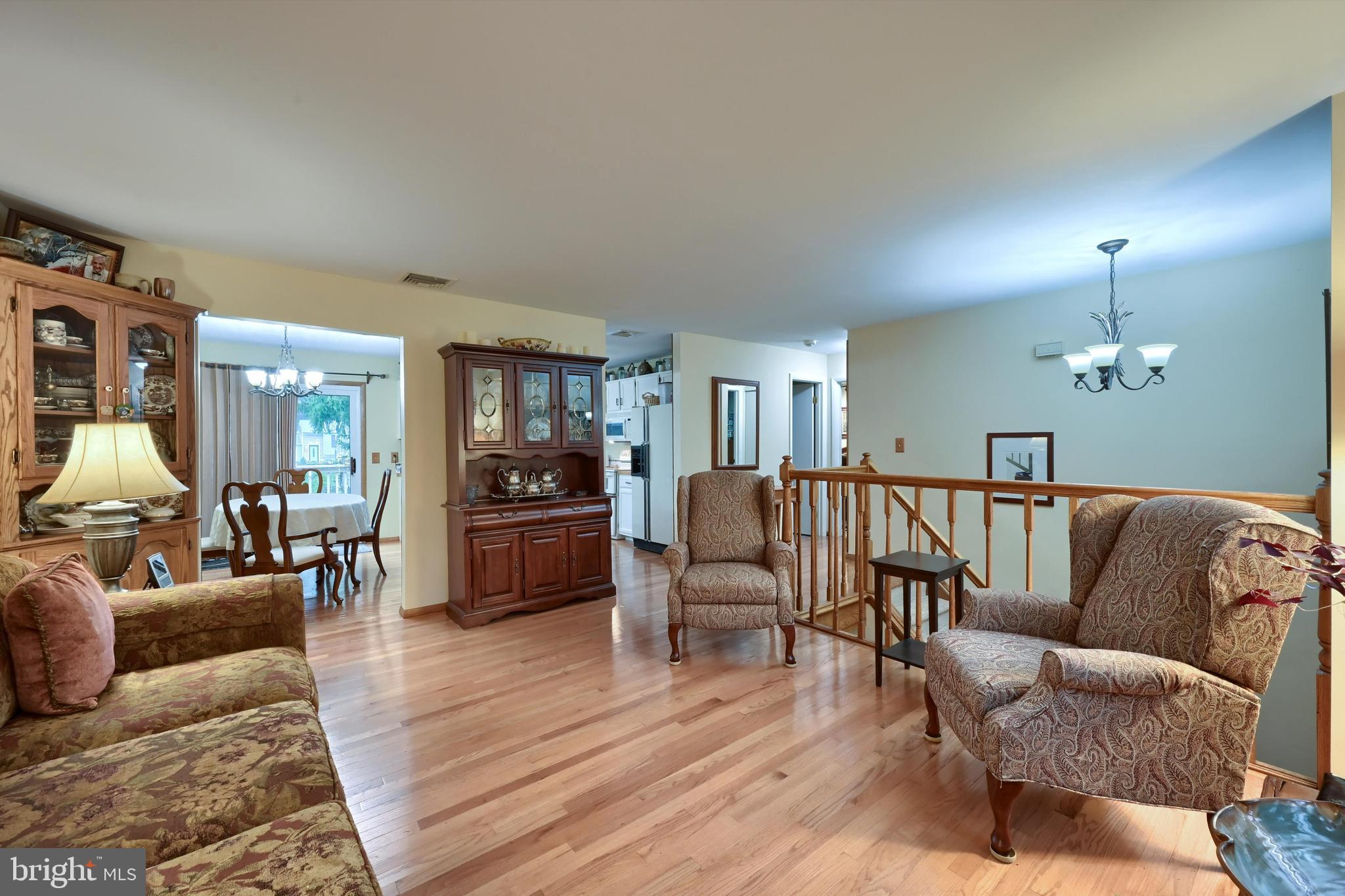 124 Petersburg Road Lancaster, PA 17601 - Photo 3 of 26 a living room with furniture kitchen view and a wooden floor