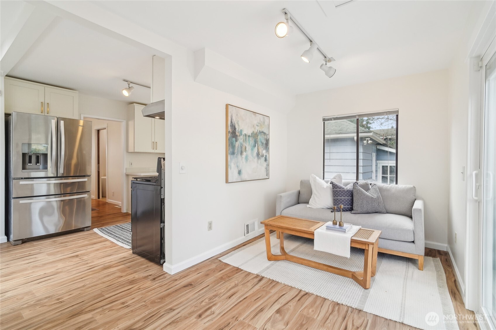 1420 North 50th Street Seattle, WA 98103 - Photo 10 of 30 a living room with furniture and a kitchen view
