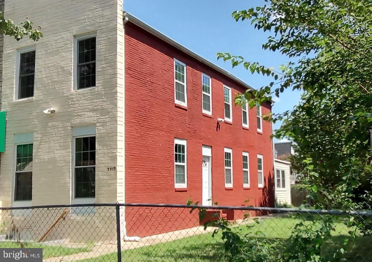 a front view of a house with yard