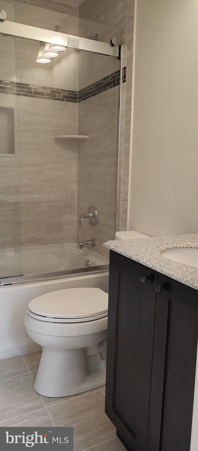 2019 Barclay Street Baltimore, MD 21218 - Photo 15 of 39 a bathroom with a toilet a sink and shower