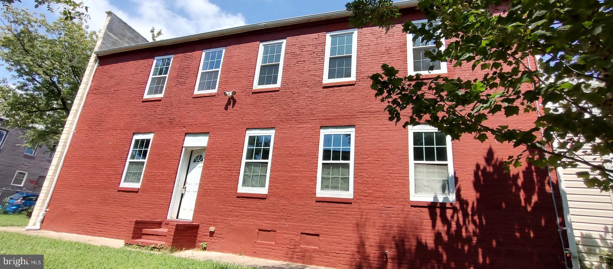 2019 Barclay Street Baltimore, MD 21218 - Photo 2 of 39 a front view of a house with a yard