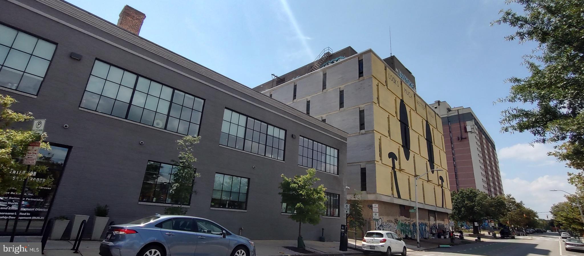 2019 Barclay Street Baltimore, MD 21218 - Photo 36 of 39 a view of a building and a cars park side of the road