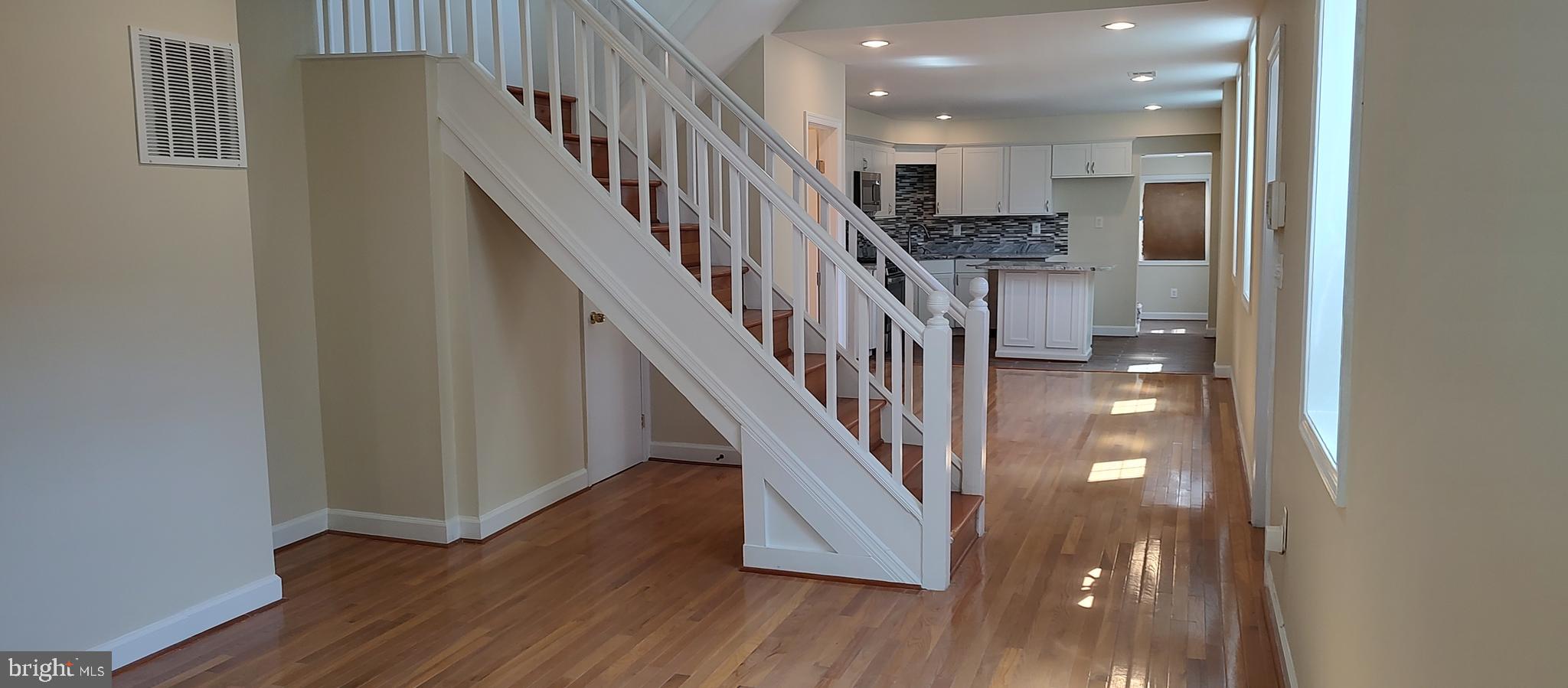 2019 Barclay Street Baltimore, MD 21218 - Photo 7 of 39 a view of entryway and hall with wooden floor