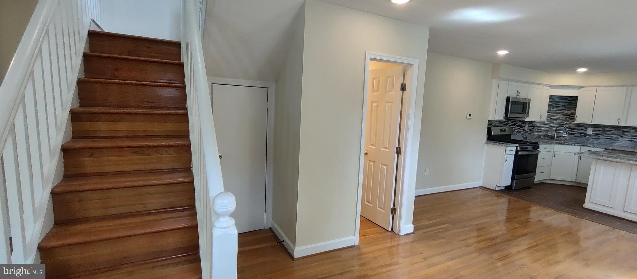 2019 Barclay Street Baltimore, MD 21218 - Photo 9 of 39 a view of a kitchen with cabinets and wooden floor