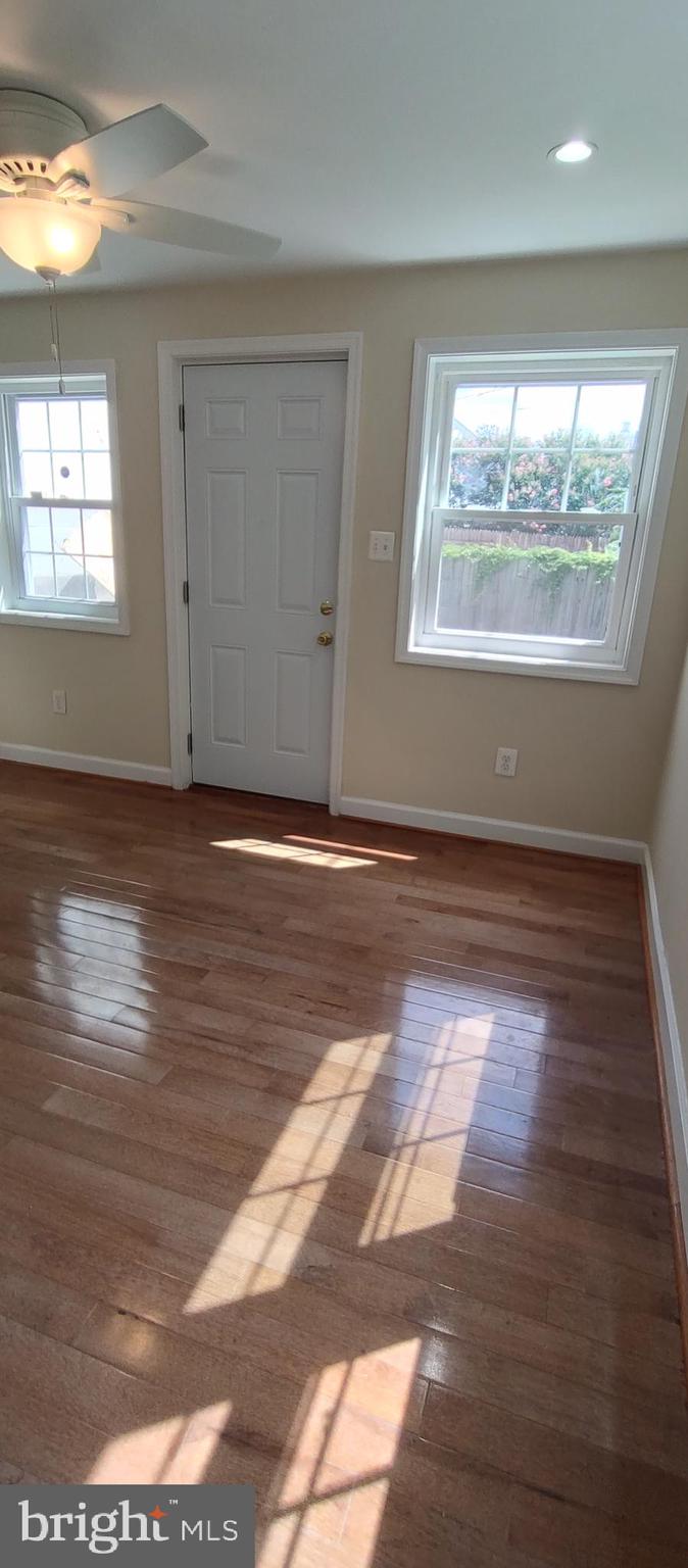 2019 Barclay Street Baltimore, MD 21218 - Photo 10 of 39 a view of empty room with wooden floor and fan