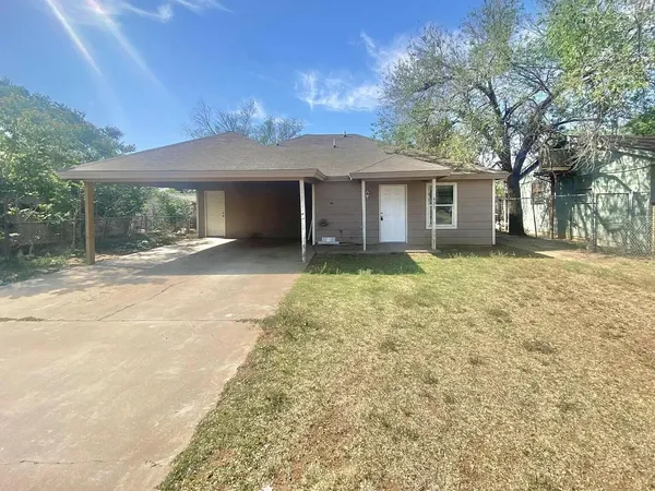 a house with yard in front of it