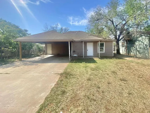a house with yard in front of it