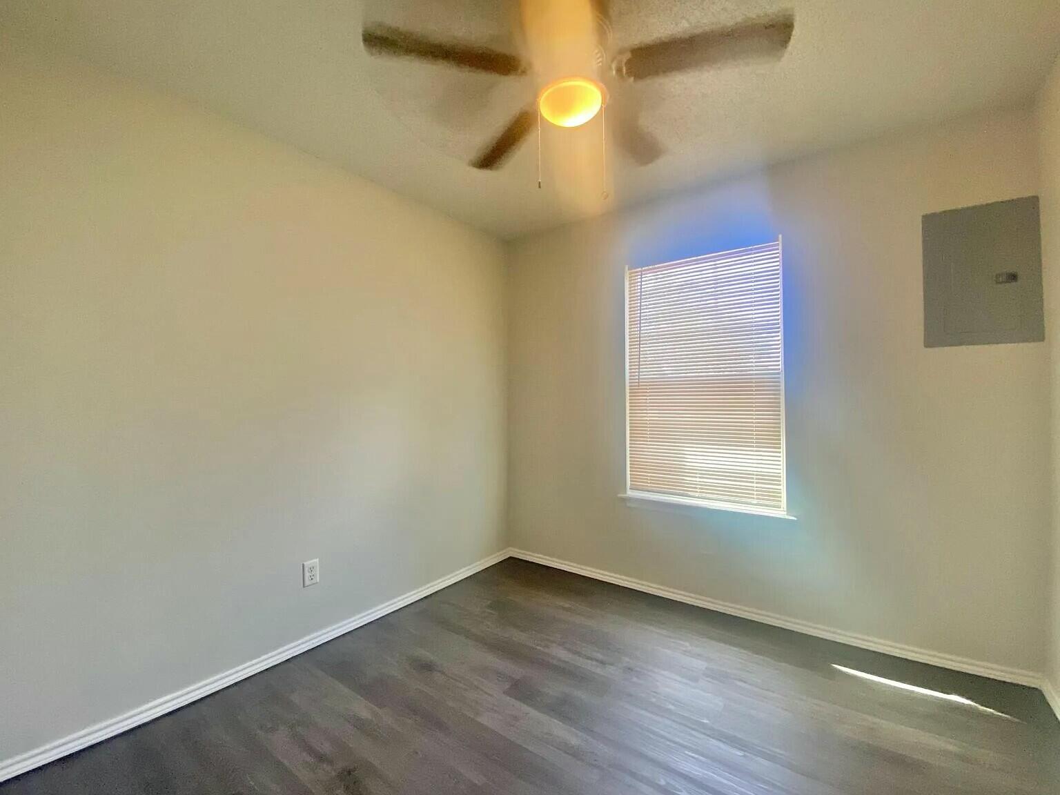 3 St Lubbock Tx 79415 Lubbock, TX 79415 - Photo 16 of 44 an empty room with a window and wooden floor