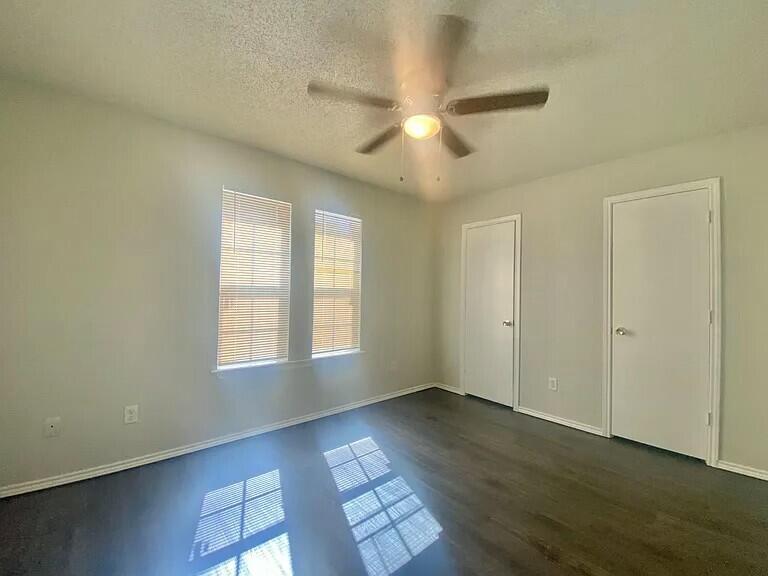 3 St Lubbock Tx 79415 Lubbock, TX 79415 - Photo 19 of 44 a view of an empty room with wooden floor and a window