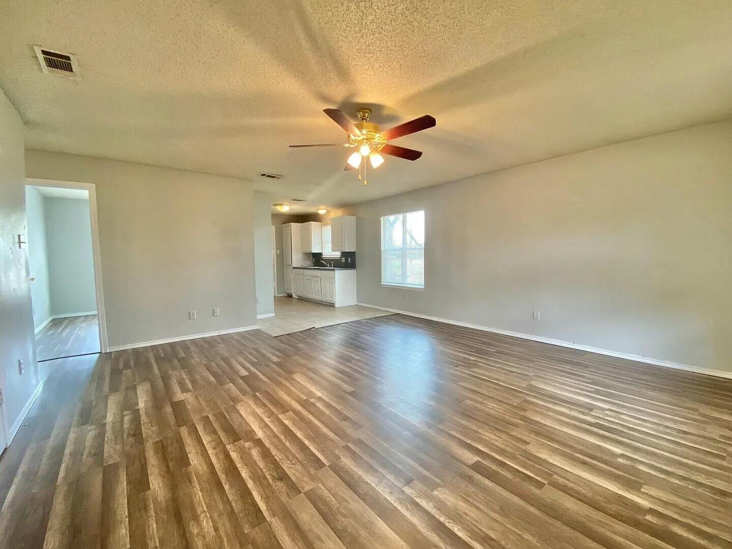3 St Lubbock Tx 79415 Lubbock, TX 79415 - Photo 2 of 44 wooden floor in an empty room with a window