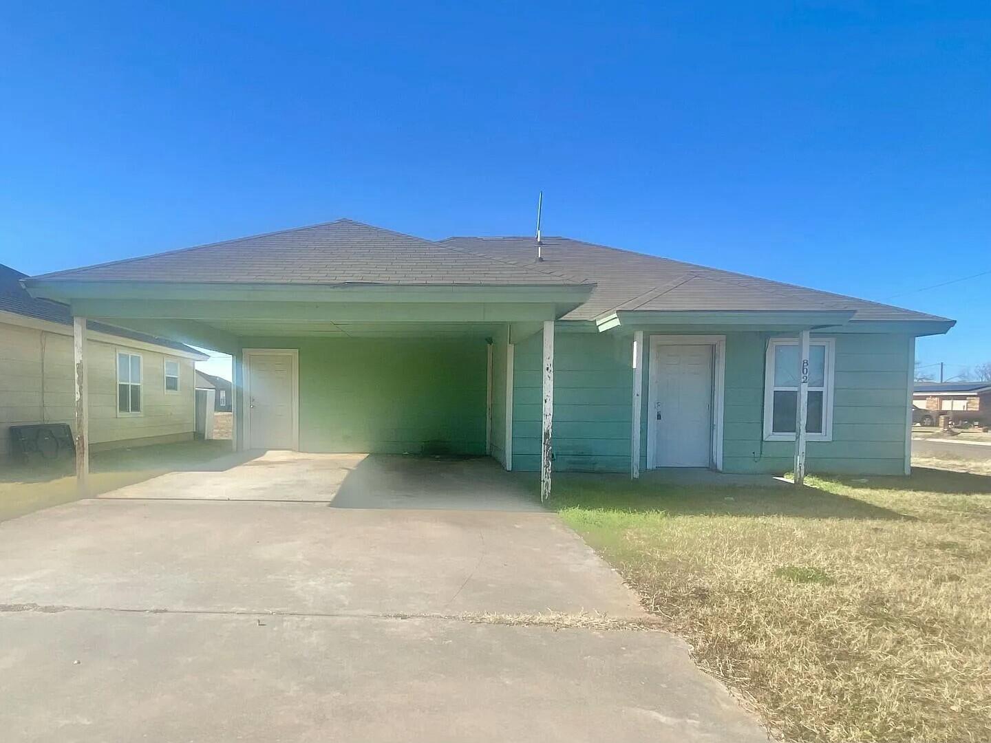 3 St Lubbock Tx 79415 Lubbock, TX 79415 - Photo 22 of 44 a view of a house with a yard and garage