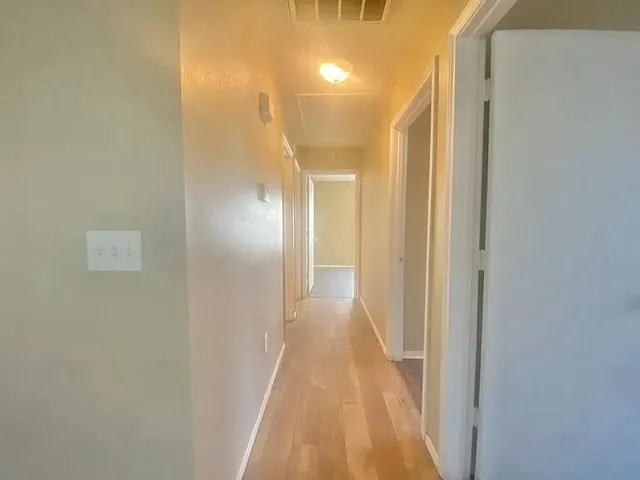 a view of a bathroom from the hallway