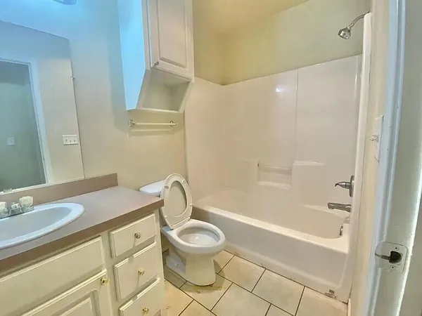 a bathroom with a sink a toilet and a bathtub