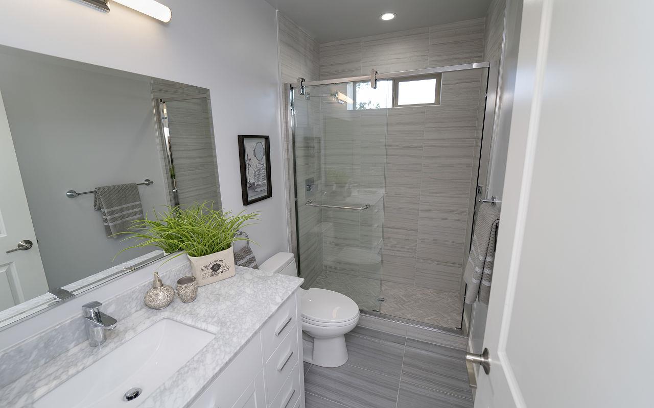 254 Hillcrest Boulevard Millbrae, CA 94030 - Photo 22 of 45 a bathroom with a shower sink vanity mirror and toilet