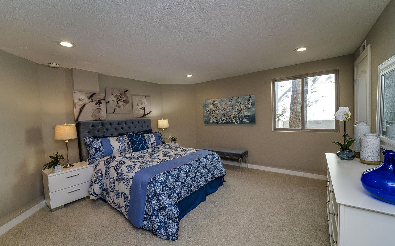 254 Hillcrest Boulevard Millbrae, CA 94030 - Photo 28 of 45 a bedroom with a bed and wooden floor