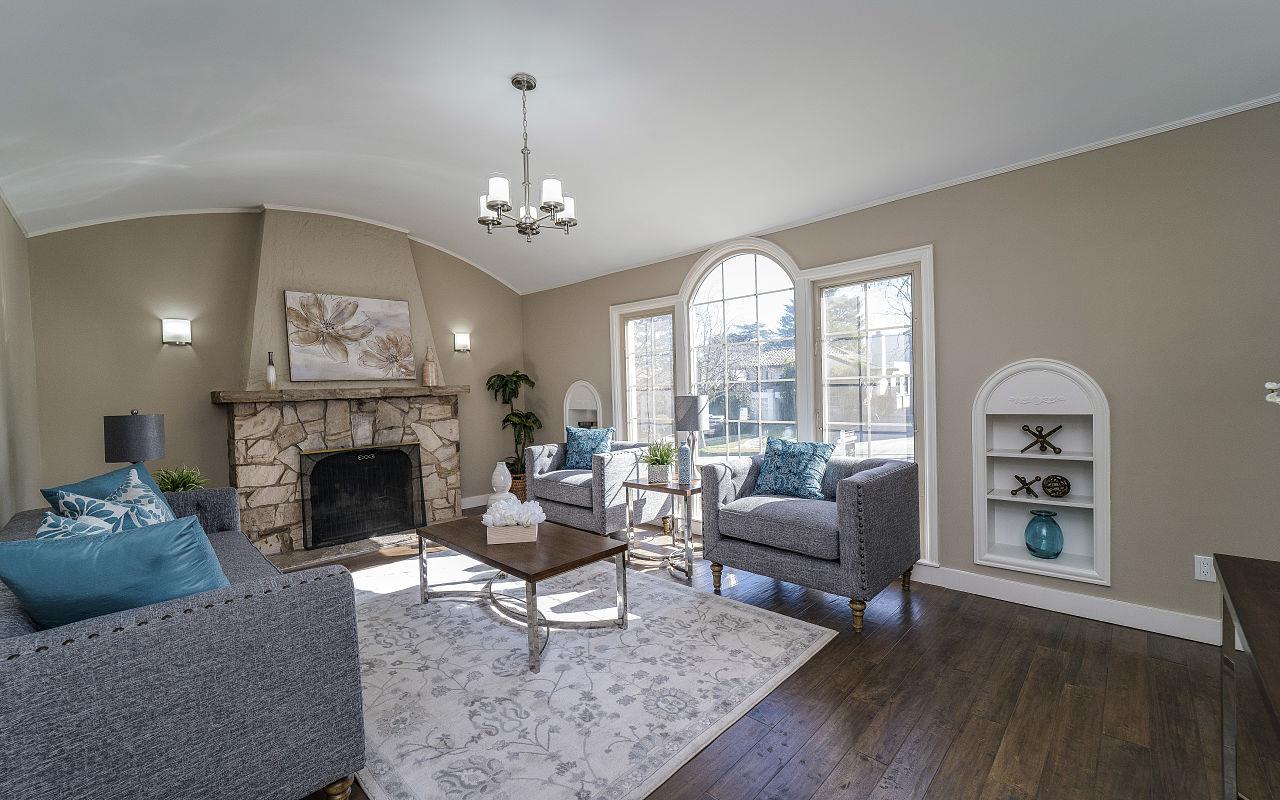 254 Hillcrest Boulevard Millbrae, CA 94030 - Photo 3 of 45 a living room with furniture a fireplace and a large window