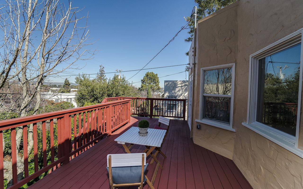 254 Hillcrest Boulevard Millbrae, CA 94030 - Photo 39 of 45 a balcony with wooden floor and outdoor seating