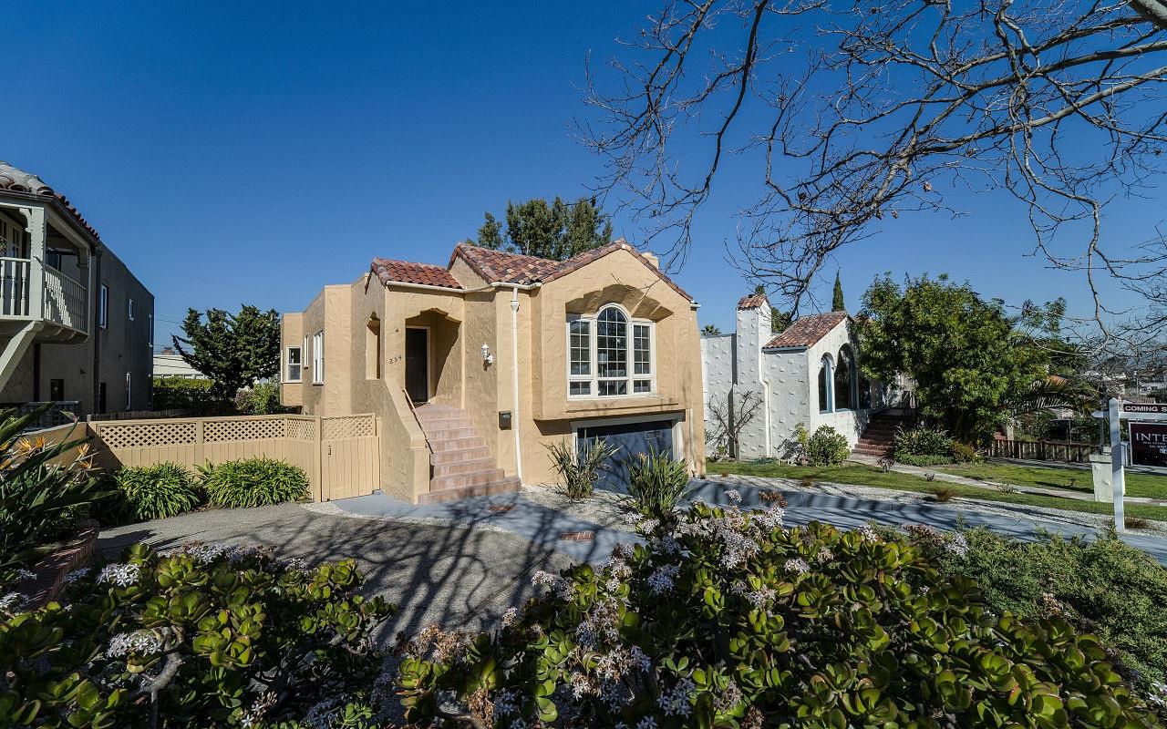 254 Hillcrest Boulevard Millbrae, CA 94030 - Photo 42 of 45 a front view of a house with a yard