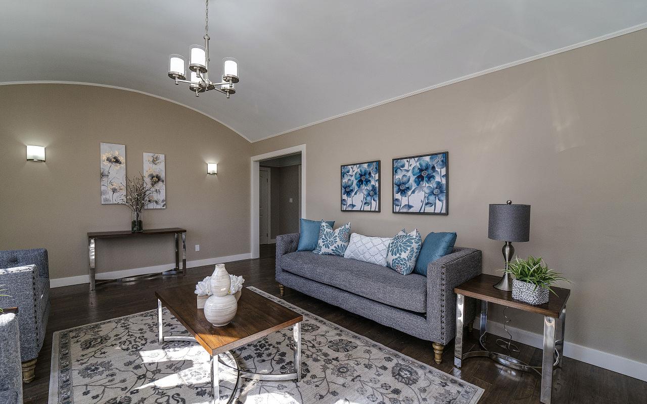 254 Hillcrest Boulevard Millbrae, CA 94030 - Photo 7 of 45 a living room with furniture and a chandelier