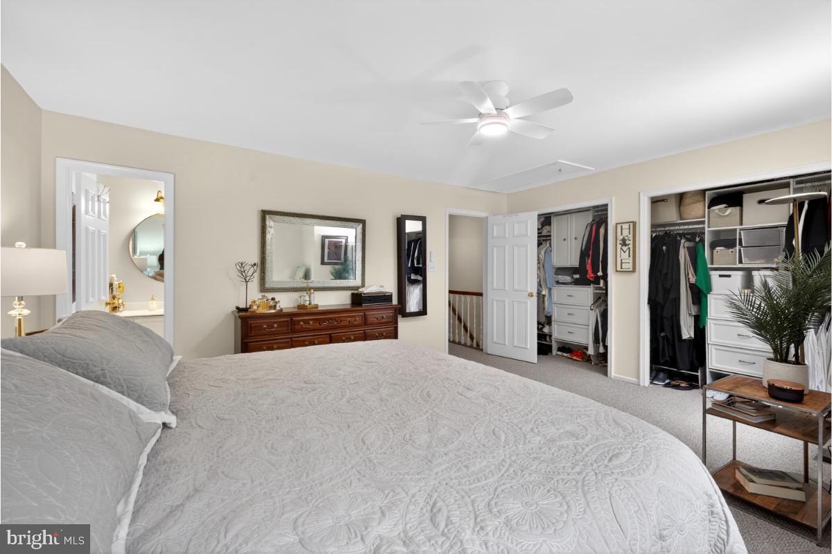 7347 Swan Point Way, Unit 122 Columbia, MD 21045 - Photo 21 of 54 a large bedroom with a large bed and flat tv screen