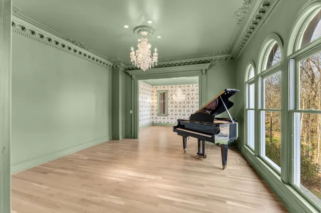 a large kitchen with stainless steel appliances granite countertop a sink and cabinets