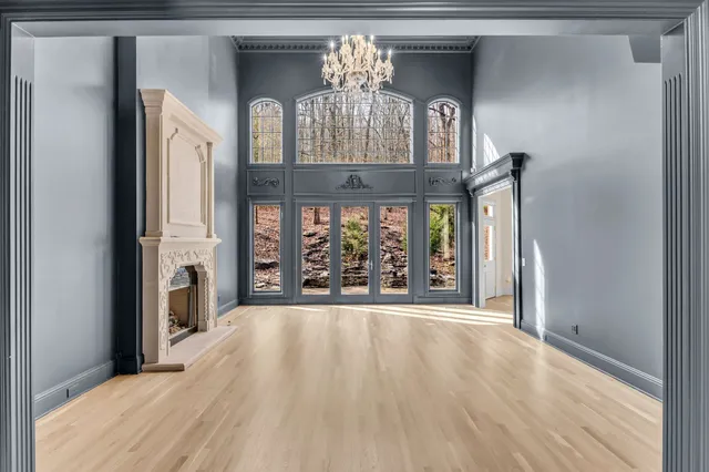 a view of walk in closet with wooden floor