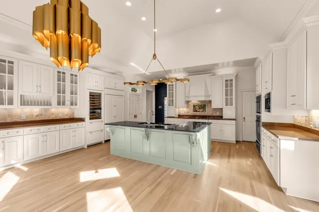 a view of an empty room with a fireplace and a window