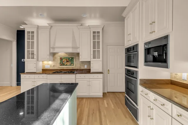 a view of front door with wooden floor