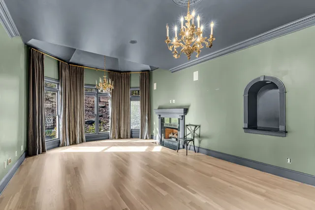 a bathroom with a sink a toilet a mirror and shower