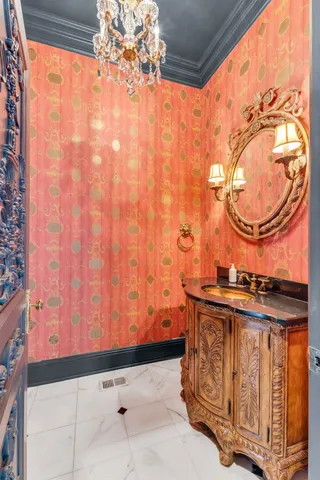 a bathroom with a granite countertop sink a large mirror and a vanity