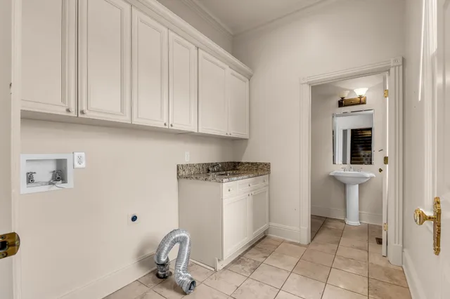 a view of a brick house with large windows