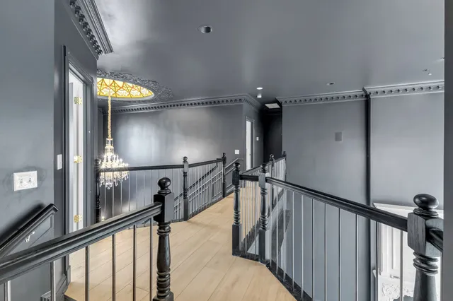 a backyard of a house with fountain table and chairs