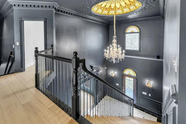 a view of a patio with plants and chairs and plants