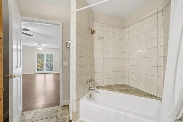 a bathroom with a shower and a toilet