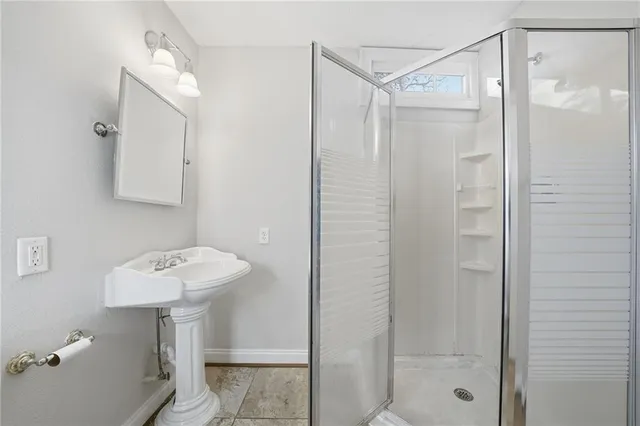 a bathroom with a bathtub and a shower