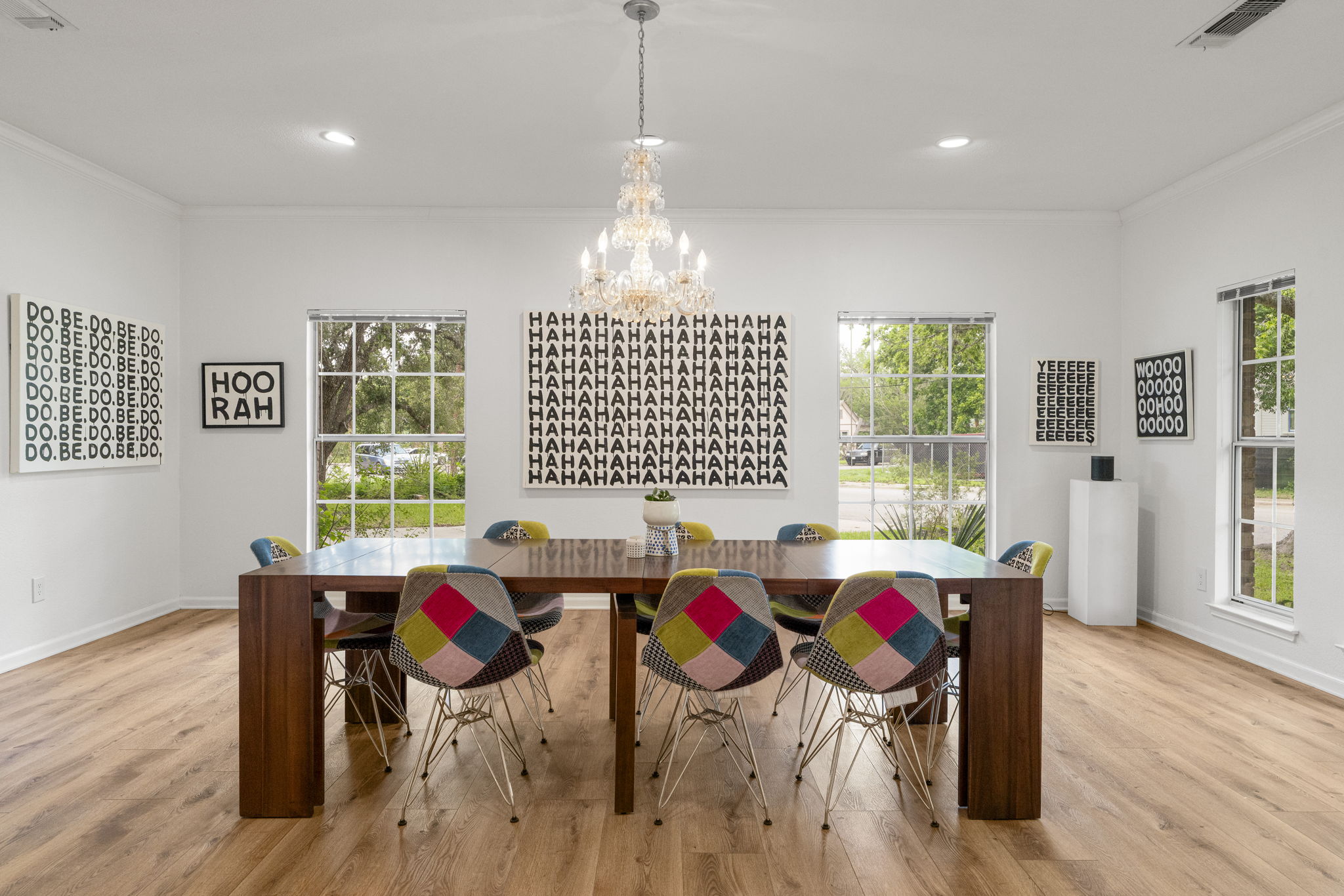 400 Hackberry Street Lockhart, TX 78644 - Photo 13 of 40 A radiant chandelier illuminates the spacious dining area, perfect for lively gatherings.
