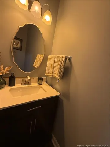 a bathroom with a sink and mirror