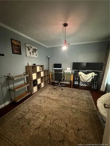 a bed room with furniture and a flat screen tv