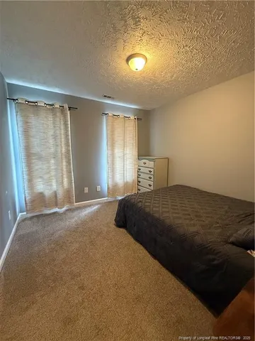 a view of livingroom with furniture and window